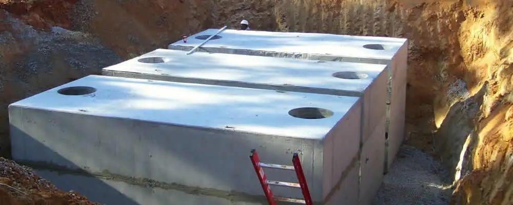 Septic tank installation site with a newly placed concrete tank in Reno, NV